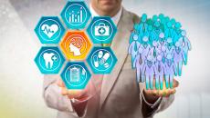 A person in a suit holds graphic healthcare solutions in one hand, and a graphic of people in the other.